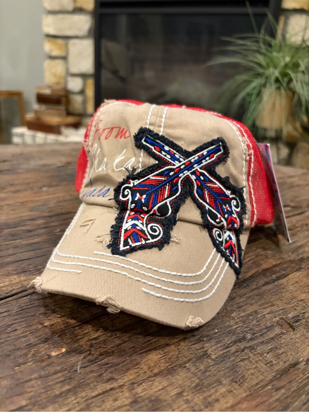Women’s Distressed Baseball Cap with Embroidered Crossed Feather Pistols